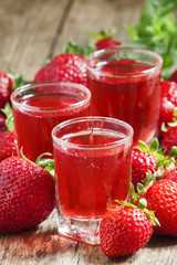 Red strawberry drink and fresh berries, selective focus