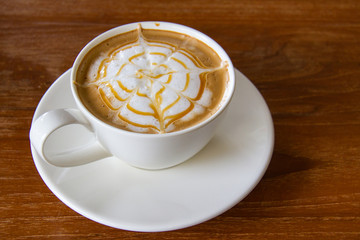 Closeup, Hot Caramel Macchiato in white coffee cup