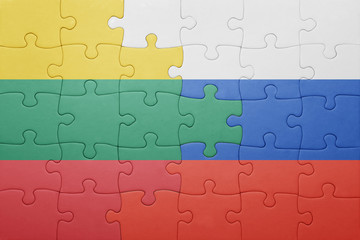 Fototapeta premium puzzle with the national flag of lithuania and russia