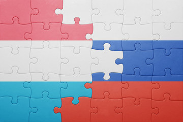 puzzle with the national flag of luxembourg and russia