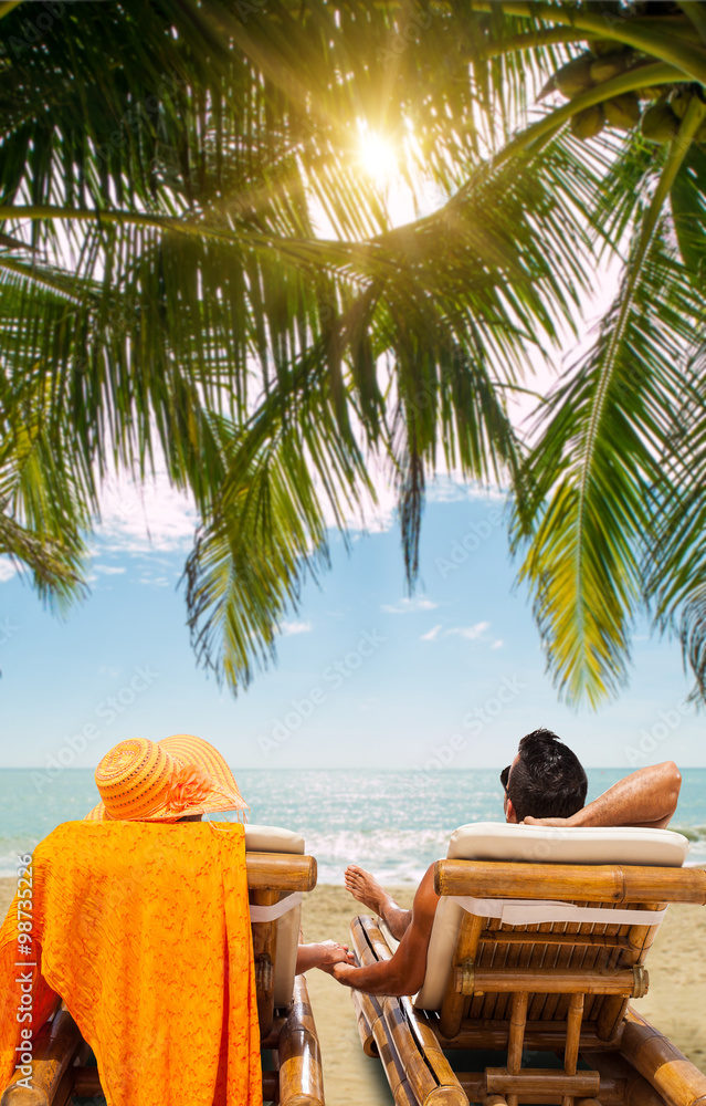 Poster Couple on the beach at tropical resort Travel concept