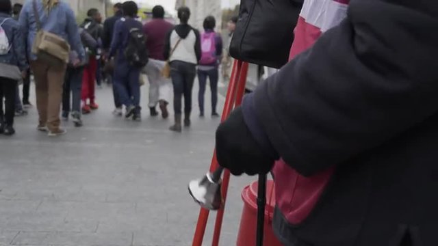 A New York City Salvation Army volunteer rings the bell for collections on a cold day.