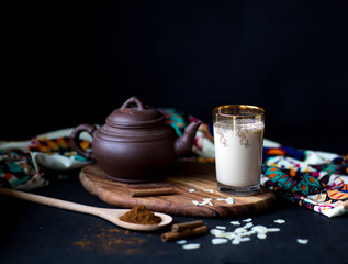 Hot tea with milk and cinnamon