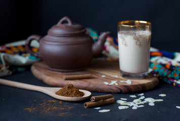 Hot tea with milk and cinnamon