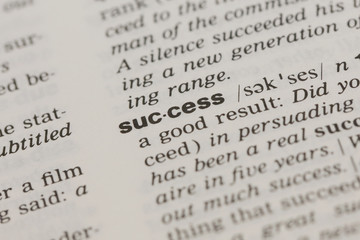 Fototapeta premium close-up on definition of the word success in the dictionary