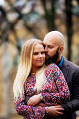 Portrait of a hugging couple in love outdoors