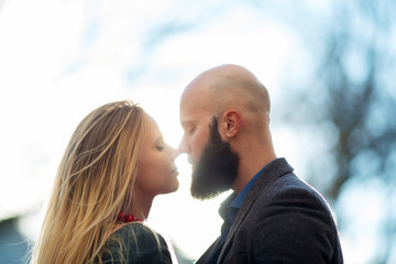 Naklejka premium Young funny pretty fashion vintage hipster couple having fun outdoor on the street in summer.