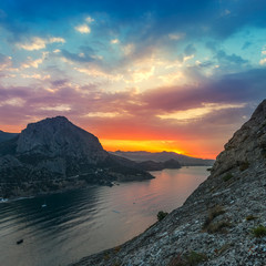 Sunrise in mountains and sea