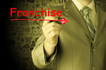 business man writing franchise