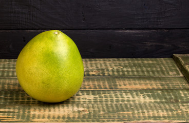 Fruit of a pomelo on an wooden table