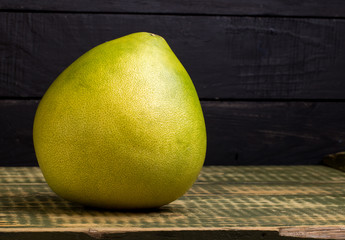 Fruit of a pomelo on an wooden table