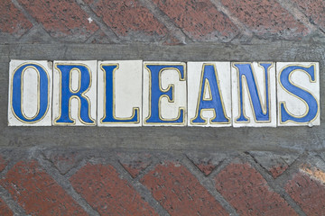 Obraz premium Sidewalk Orleans Street Sign