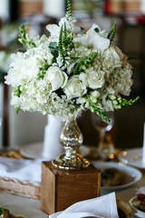 Elegant stylish decorated wedding reception tables with glasses