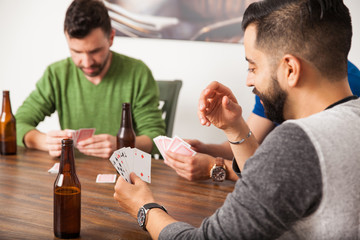 Guys playing poker at home