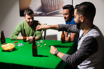 Men playing dice and drinking beer
