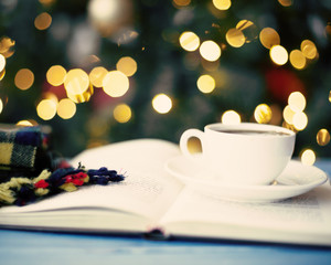 Coffee cup, scarf and book