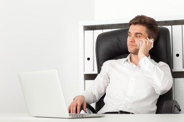Portrait of business man talking on the phone