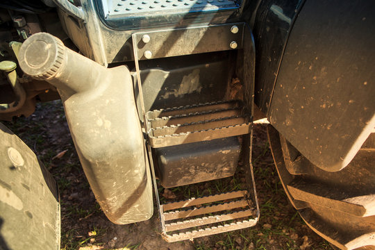 metal steps up to cultivator tractor cabin by petrol tank