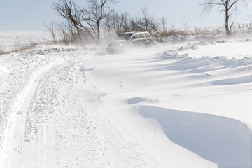 Fototapeta na wymiar Driving in Drifting Snow