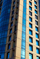 Modern building mirror facade in blue tone