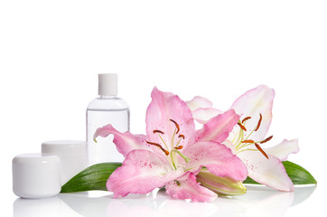 Fototapeta na wymiar cosmetic set for skin care on a white background with flowers li