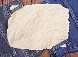 a sheet of paper on the jeans
