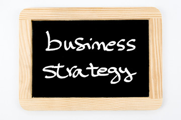 Obraz premium Vintage Chalkboard with wooden frame isolated on white, message Business Strategy