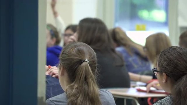 Students working at their desks in a classroom