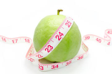 Measuring tape wrapped around a Guava