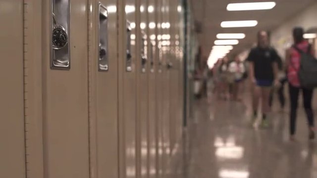 Students walking down hall by lockers