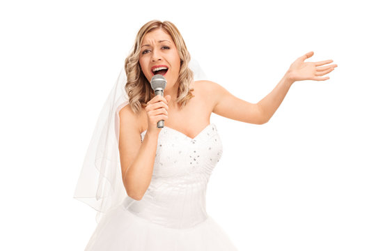 Young bride singing on a microphone