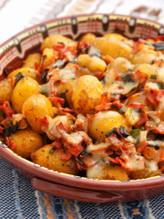 Baked potatoes with ham and cheese
