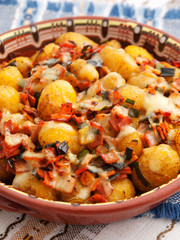 Baked potatoes with ham and cheese