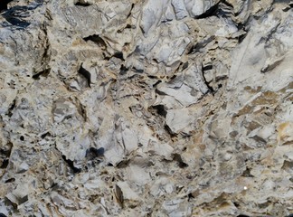 Fototapeta premium The stones are laid near the shoreline near the water. 