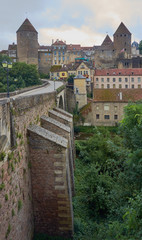 Fototapeta na wymiar Stone bridge and medieval buildings in a small town in France.
