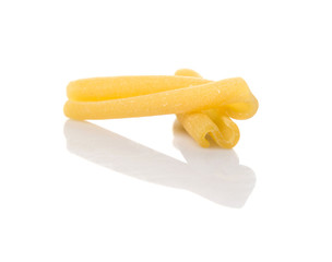 Dried casarecce pasta or long twist pasta shape over white background