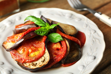 Ratatouille on plate, on table background