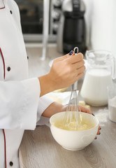 Cooking buttery cream on kitchen