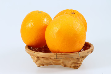 mandarin fruit in the basket isolated on white background
