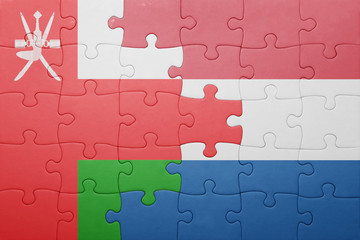 Fototapeta premium puzzle with the national flag of netherlands and oman