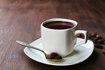 Cacao and coffee beans on wooden background
