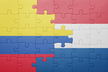 Fototapeta premium puzzle with the national flag of netherlands and colombia