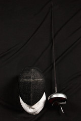 The fencing mask and rapier 