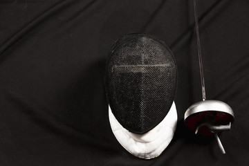 The fencing mask and rapier 