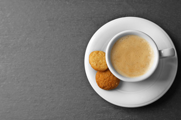 Cup of coffee on gray background