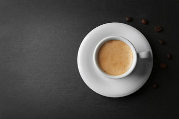 Obraz na płótnie Canvas Cup of coffee on gray background