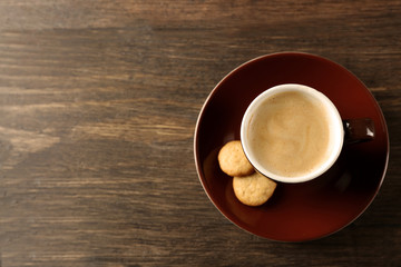 Cup of coffee on wooden background