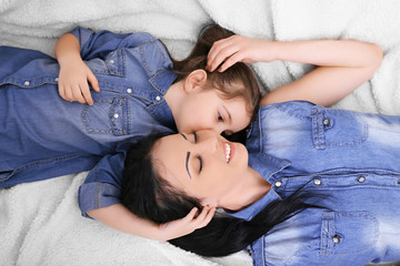 Mother and daughter on the sofa closeup