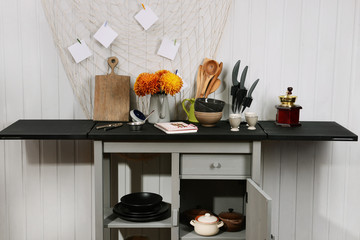 Kitchenware on table in the room