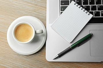 Empty  notebook on laptop keyboard, on light background